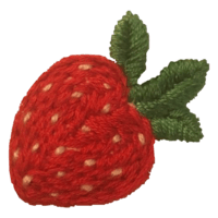 a knitted strawberry brooch with green leaves