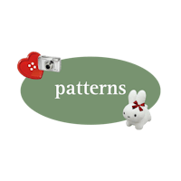 a pattern with a camera, a heart, and a bunny