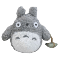 a totoro plush toy with a white face